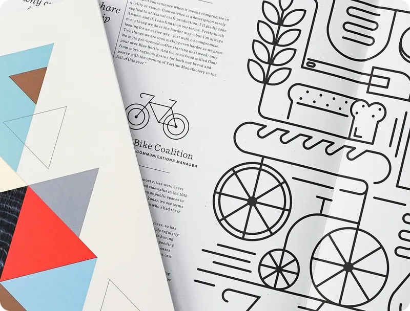 Printed brand guidelines with geometric shapes and line illustrations of a bicycle and bakery