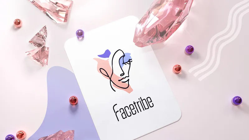 Facetribe line-art face logo on a card among pink crystals