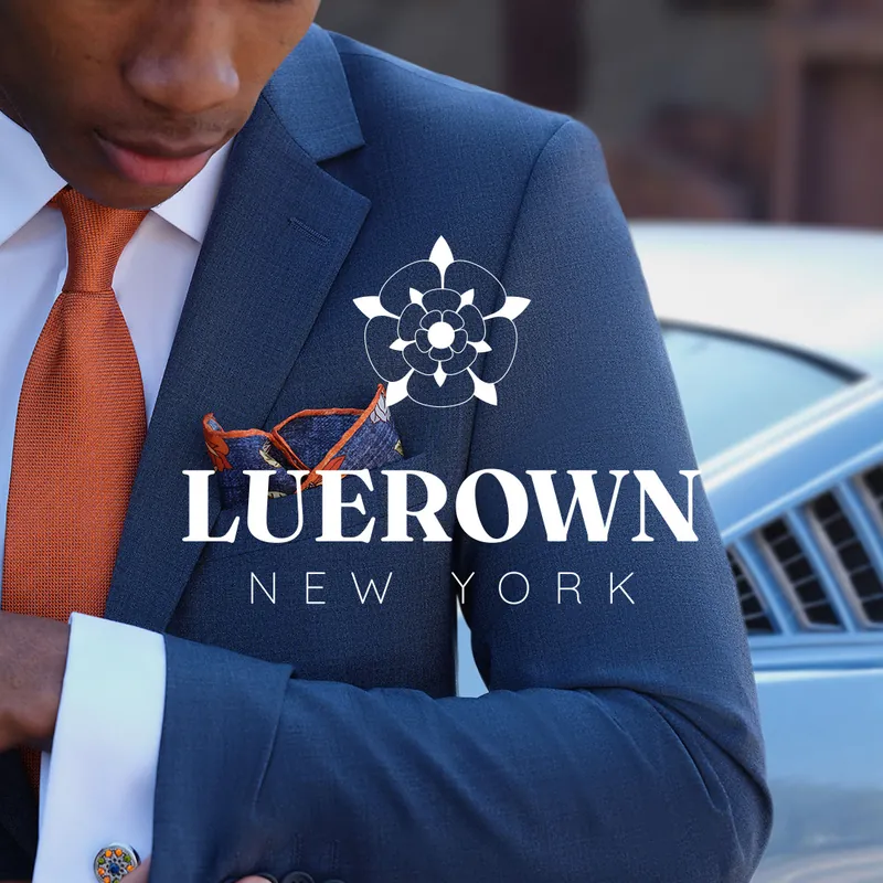 Luerown New York logo over a man in a navy tailored suit