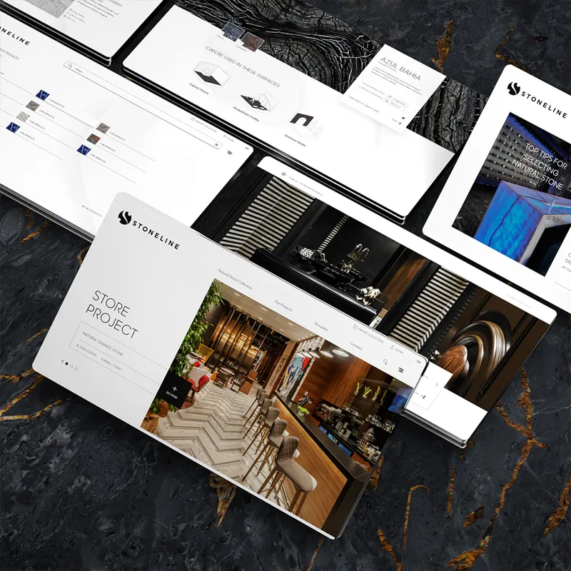 Stoneline website pages laid out over a dark natural stone slab