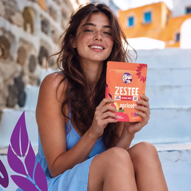 Woman holding a Zestee snack package