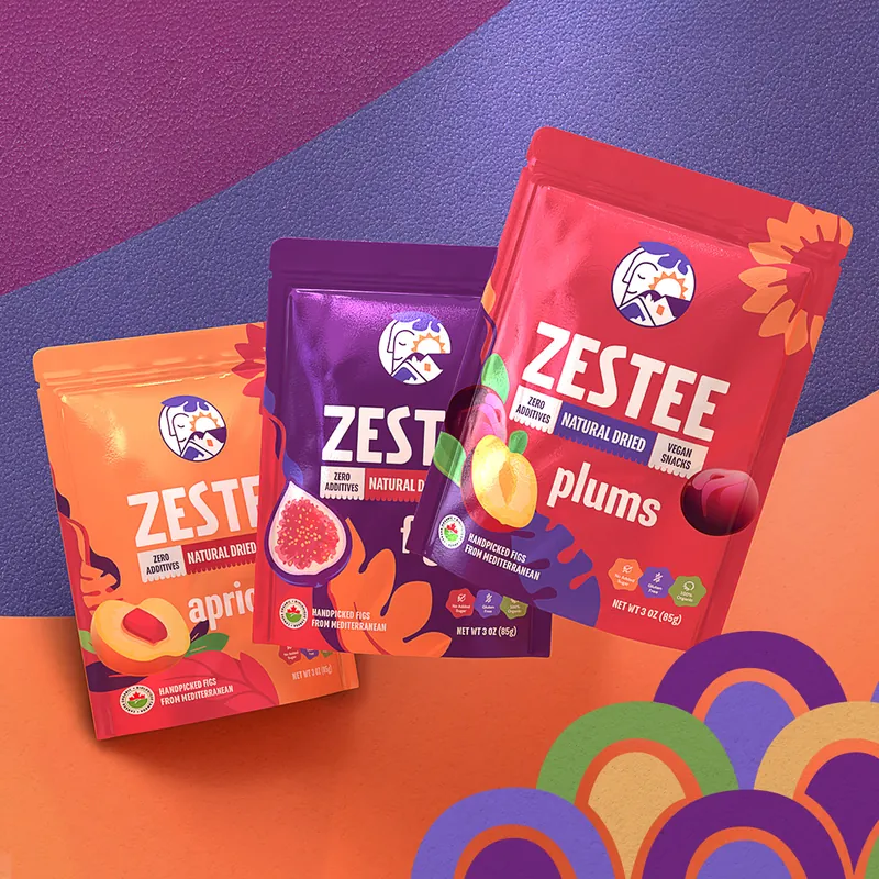 Three colourful Zestee fruit snack pouches on a purple and orange background